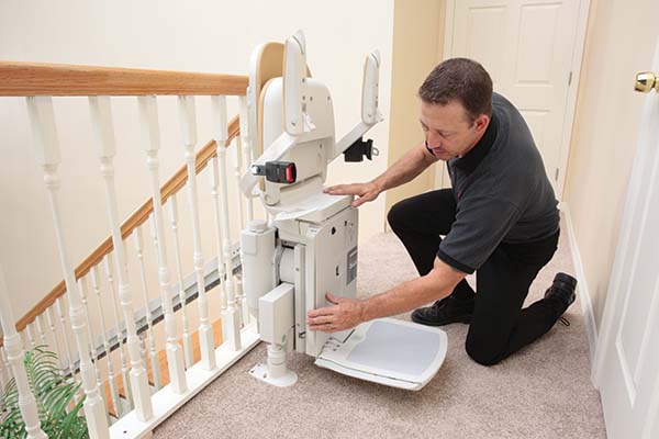 stairlift technician servicing stair lift